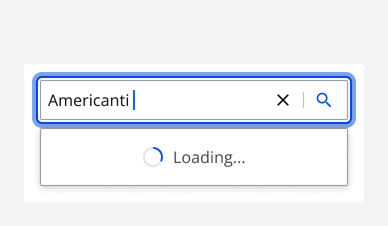 A search bar with an entered search term that displays a loading indicator whilst the search is occurring.